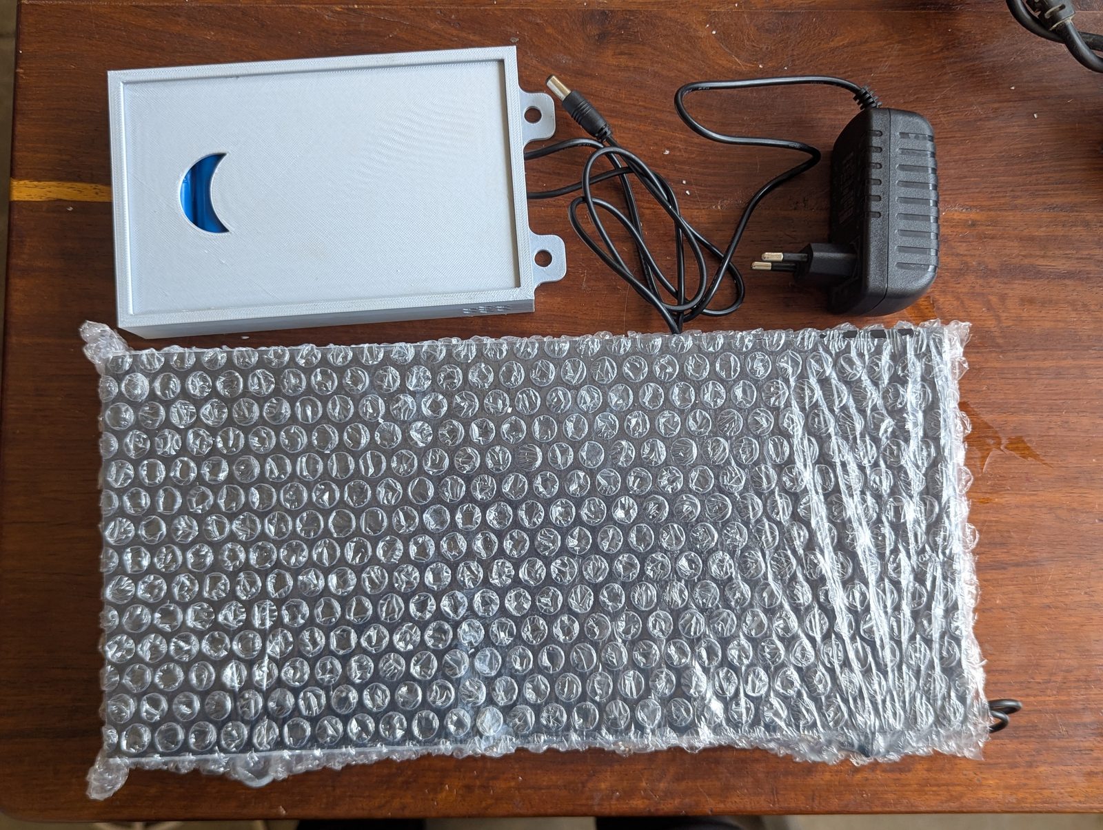 The clock and battery backup pack packaged for delivery to the airport